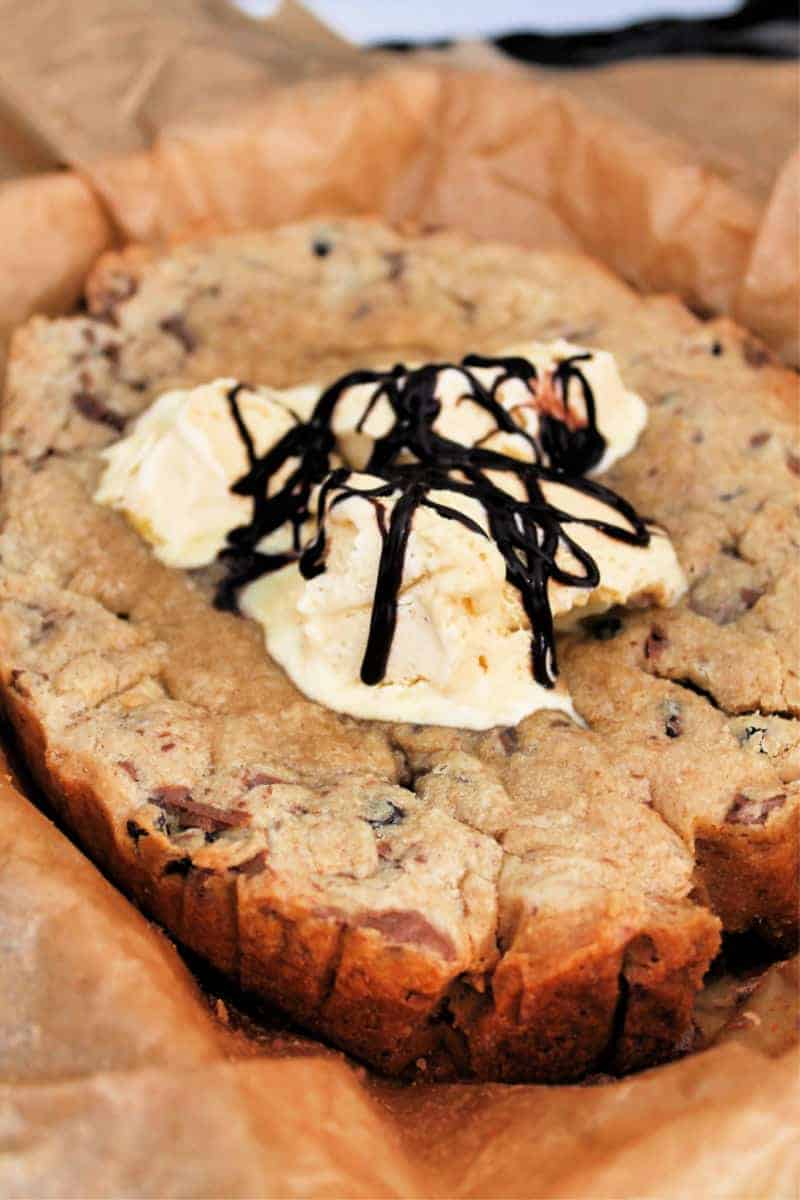 Slow cooker giant cookie with ice cream and chocolate sauce