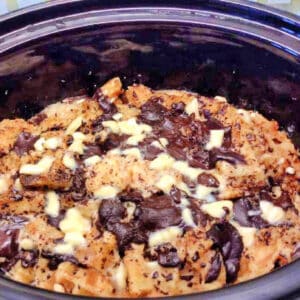 Chocolate pudding with baked waffles in slow cooker pot.