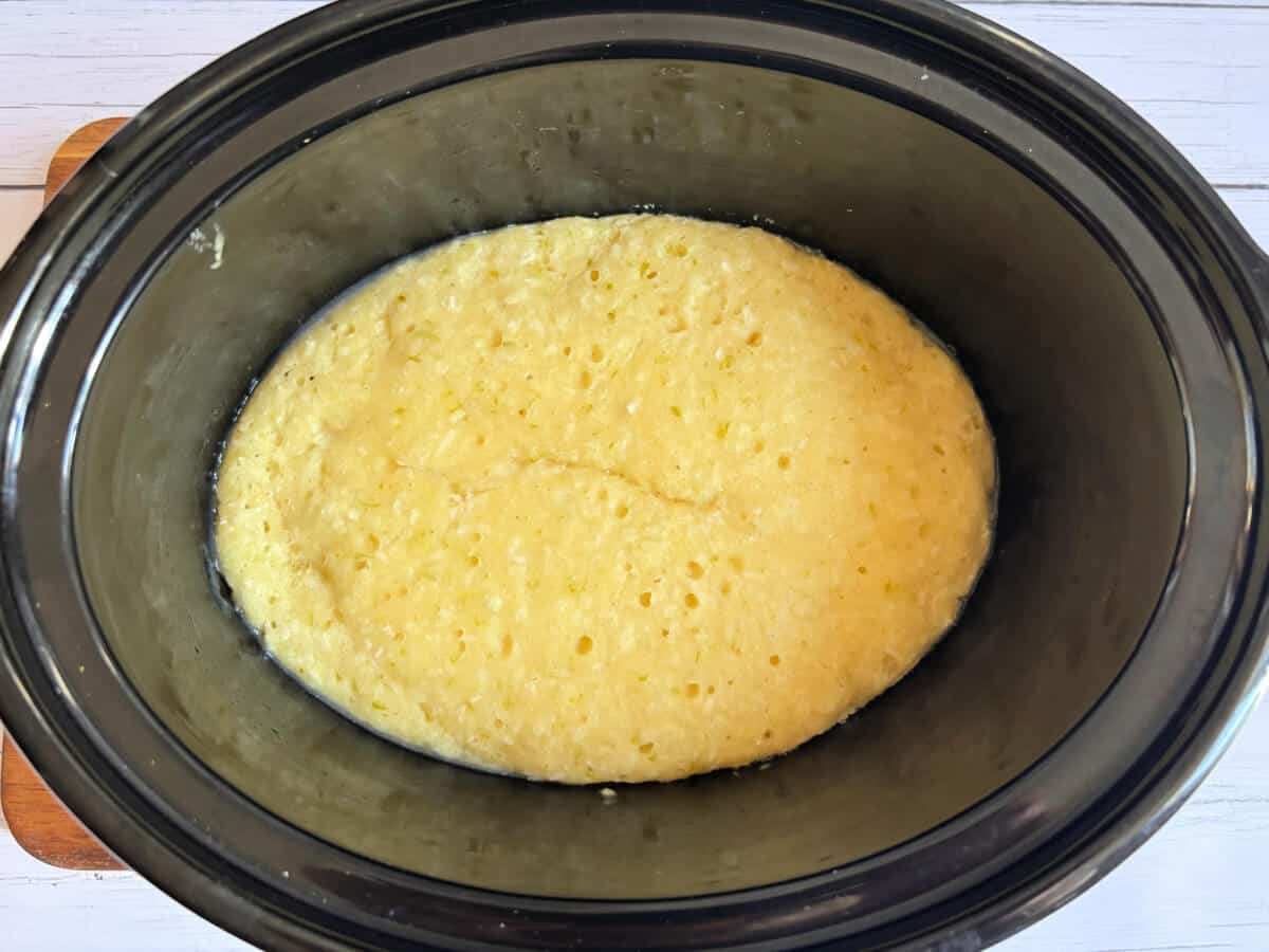 Baked sponge pudding in slow cooker dish.