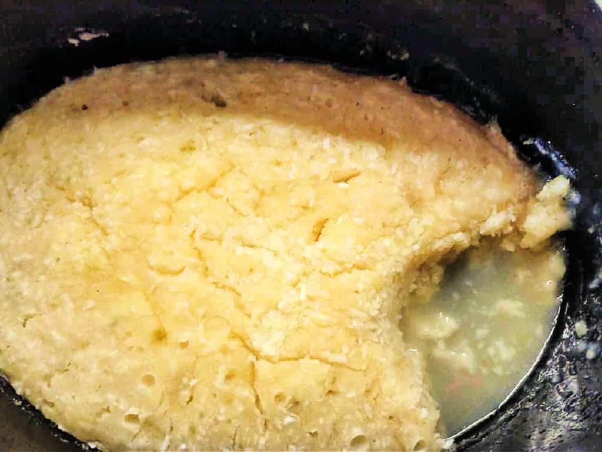 Lime sponge pudding in a slow cooker pot.