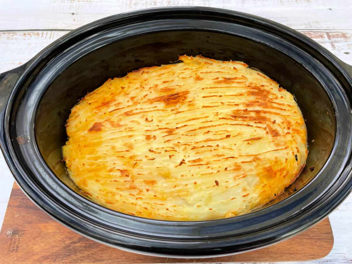 Slow cooker shepherd's pie with browned mash, after cooking under the grill.