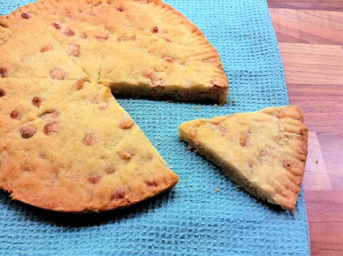 White chocolate shortbread with a slice cut out.