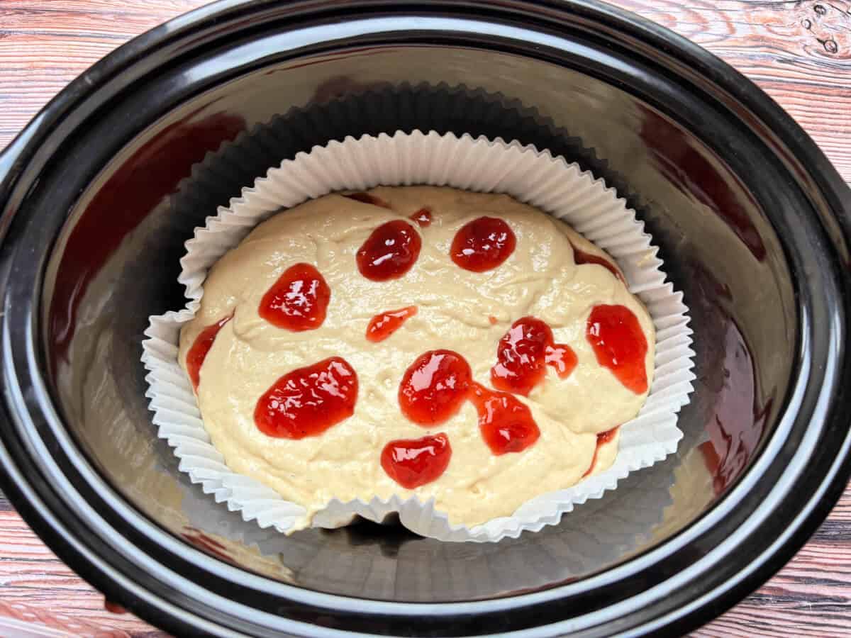 Cake mixture with more spoonfuls of jam.
