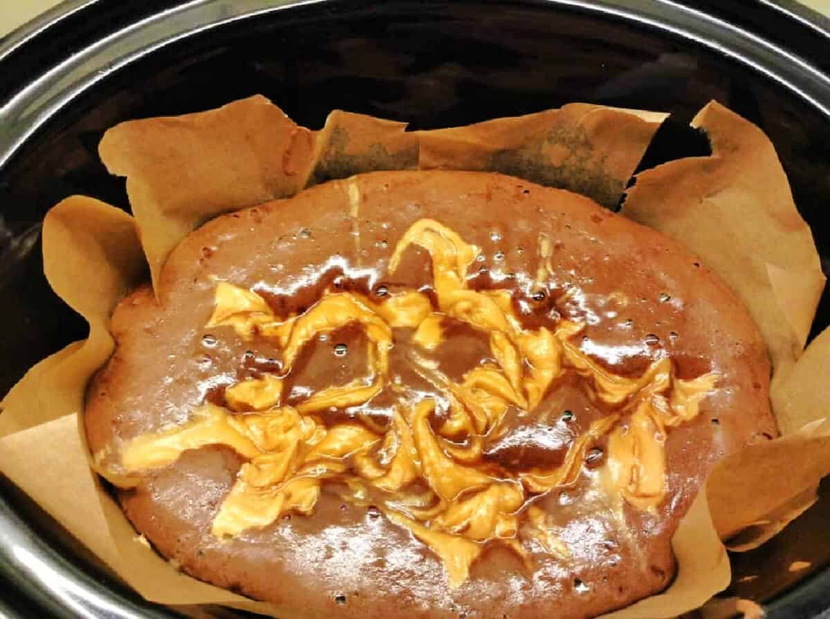 Brownies cooking in slow cooker pot.