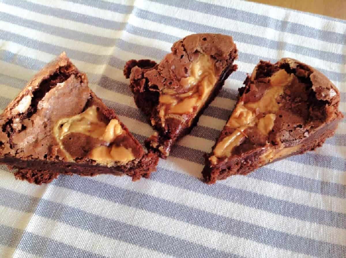 Three brownie triangles with peanut swirl.