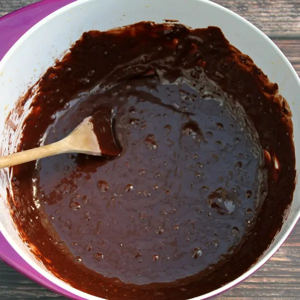Chocolate cake batter in white bowl.
