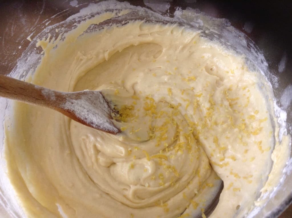 Cake mixture in bowl with lemon zest.