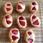 Strawberry friands on a cooling rack.
