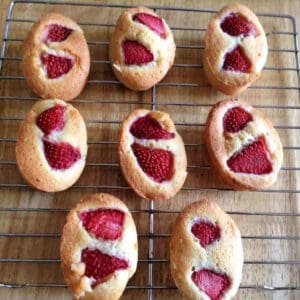 Strawberry friands on a cooling rack.