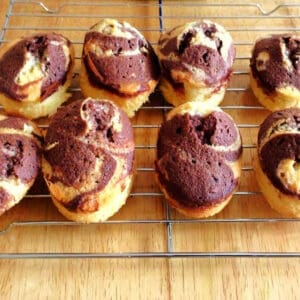 Mini marbled cakes on cooling rack.