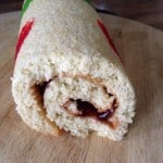 Swiss roll showing the swirl inside, filled with jam.