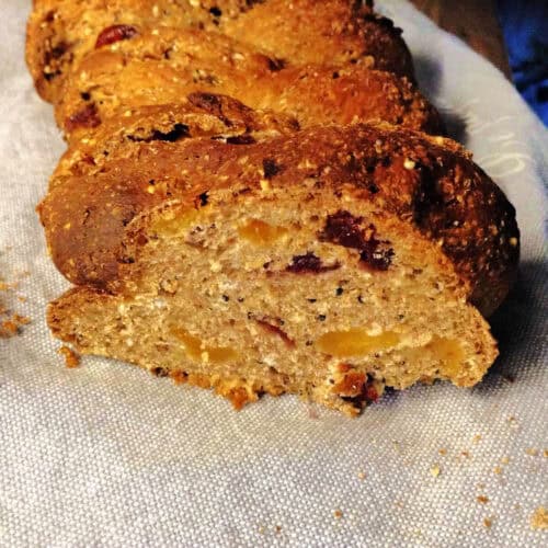 Braided loaf with fruit filling sliced open to show the inside.