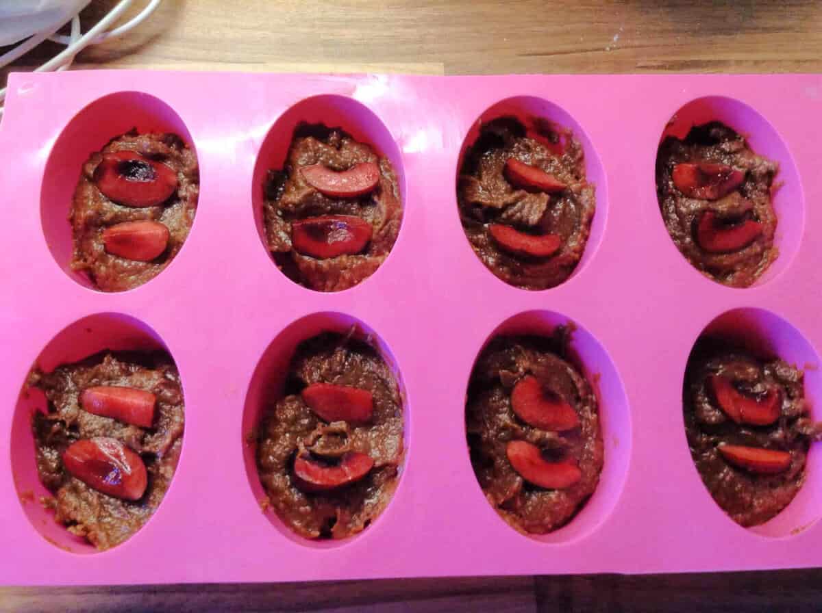 Friands in mould with cherries.