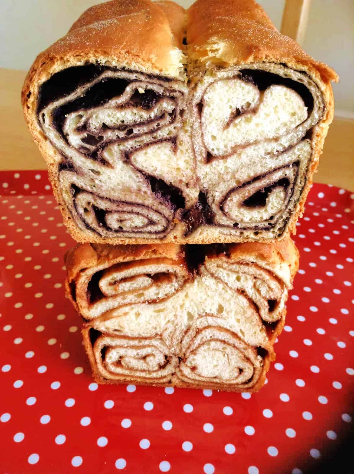 Two swirled Croatian povitica loaves stacked on top of each other.