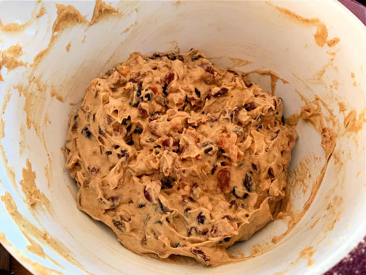 Christmas Cake mixture with dried fruit added, in a mixing bowl.