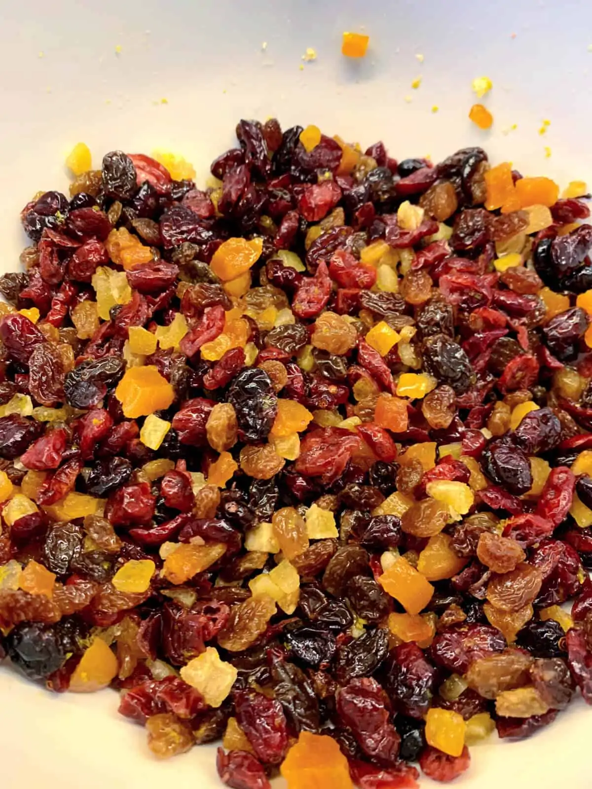 Mixed dried fruit for Christmas Cake soaking in a bowl.