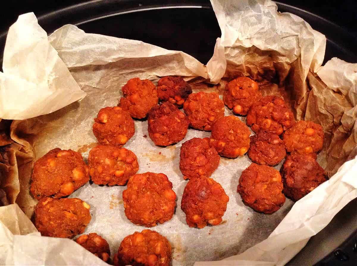 Cooked falafel in slow cooker pot.