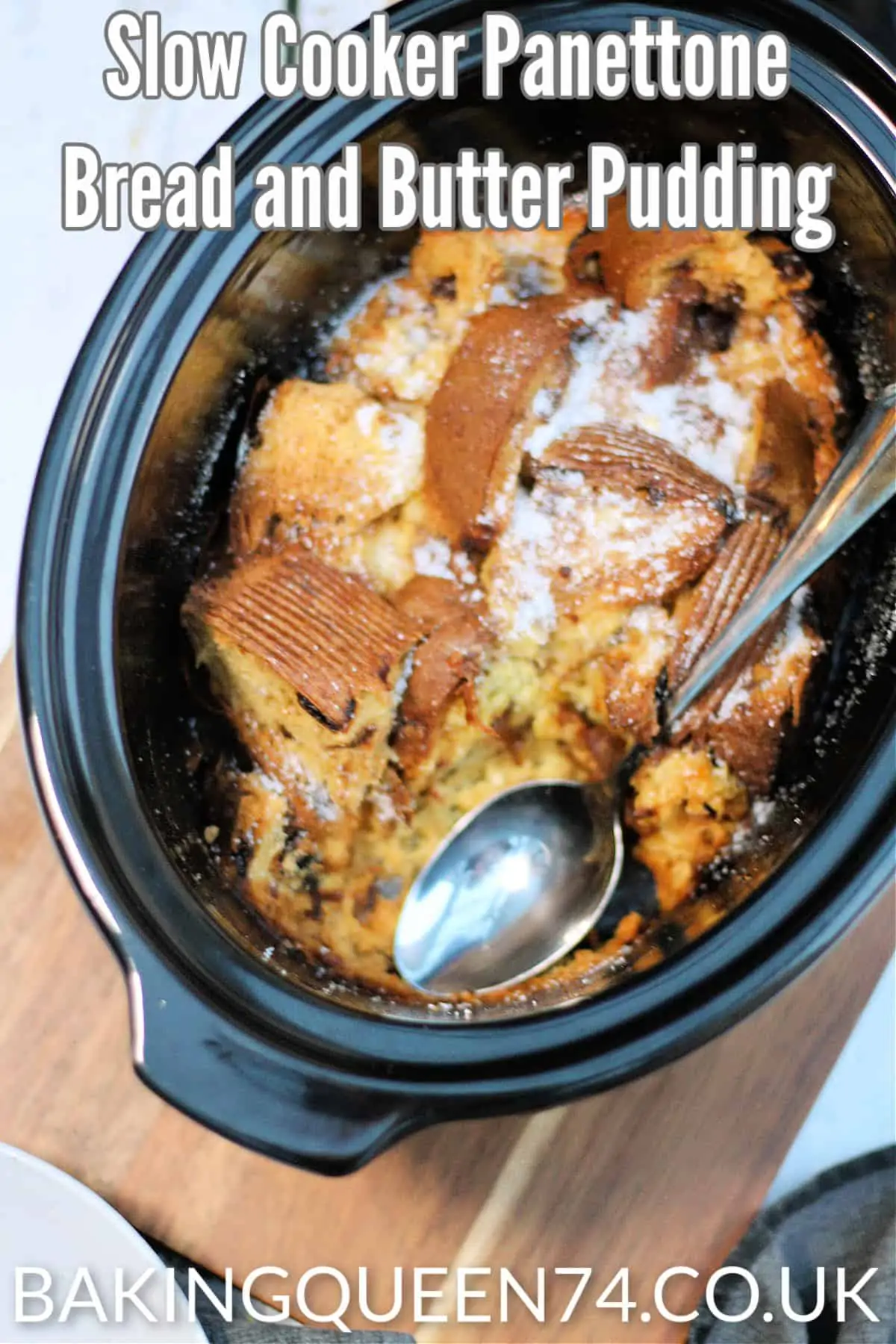 Image of dessert in slow cooker pot with text over (slow cooker panettone bread and butter pudding).