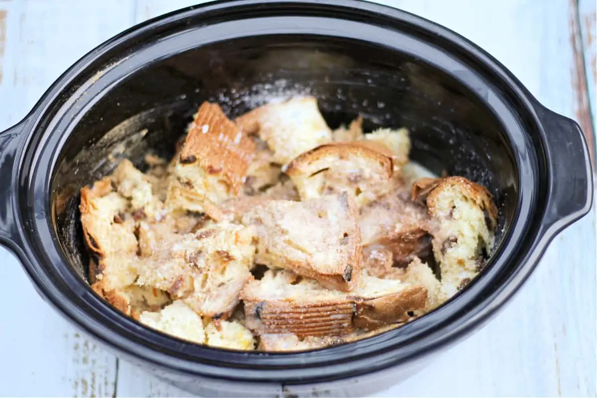 Panettone pudding in slow cooker pot ready to cook.