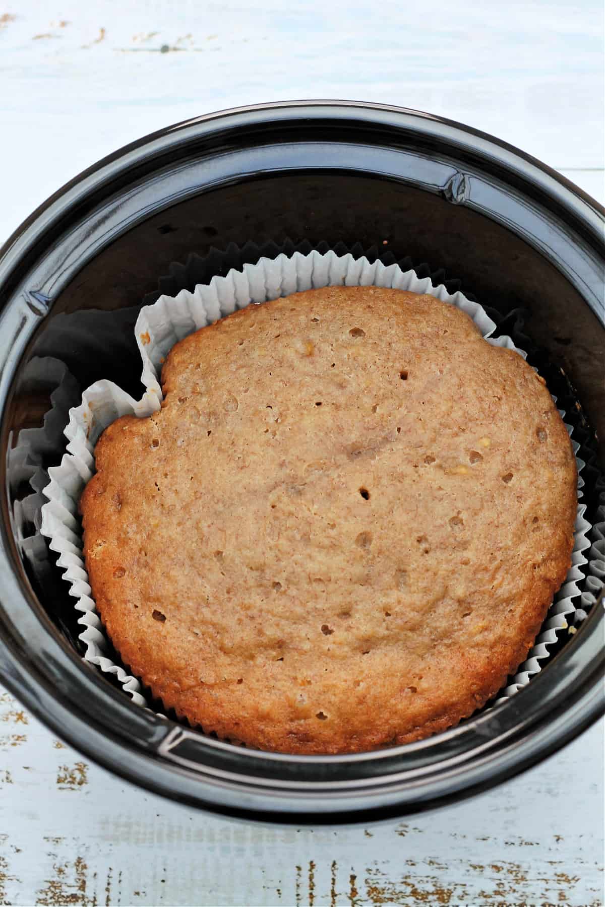 Banana bread in slow cooker pot.