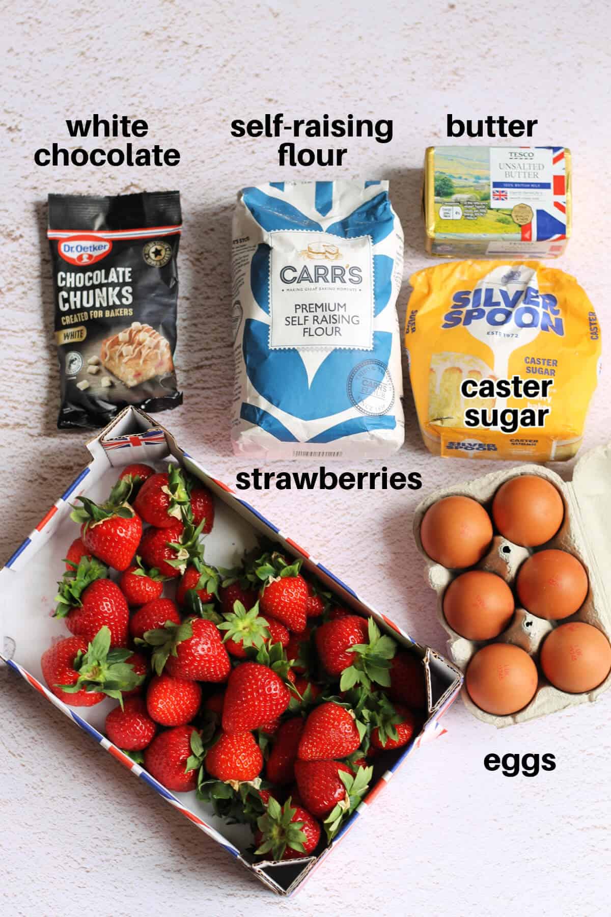Labelled ingredients on a white table.