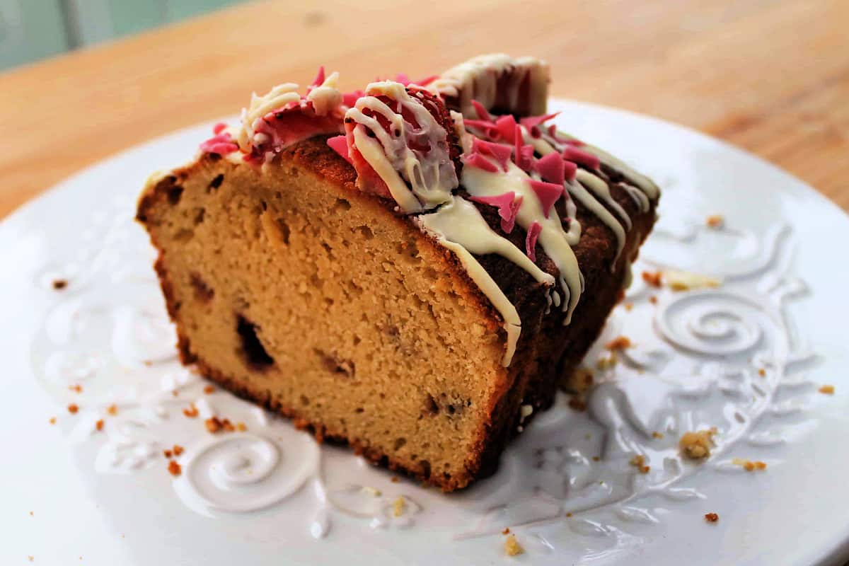 Sliced cake showing the chunks of strawberry within.