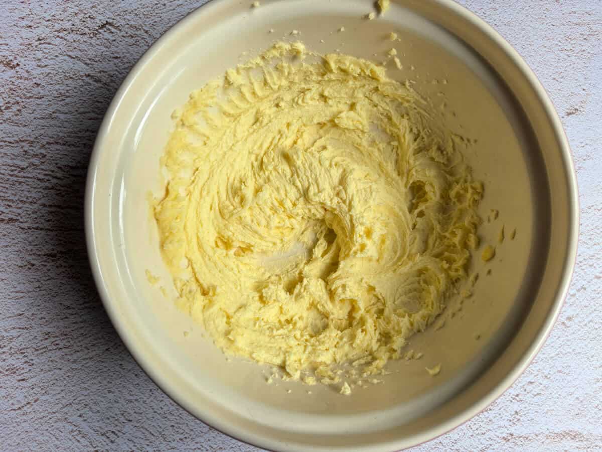 Mixing bowl with sugar and butter in it, creamed together.
