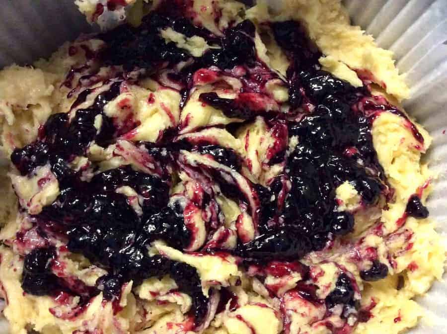 Cake mixture with blueberry jam marbled in.