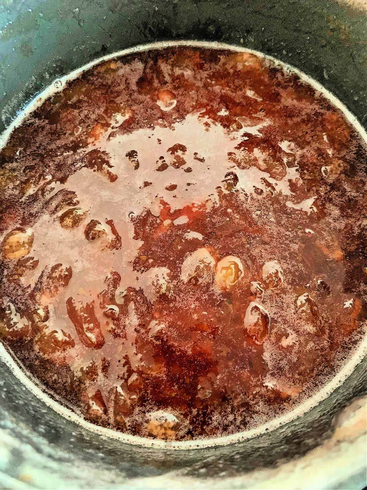 Gooseberry jam in jam pan, cooked.