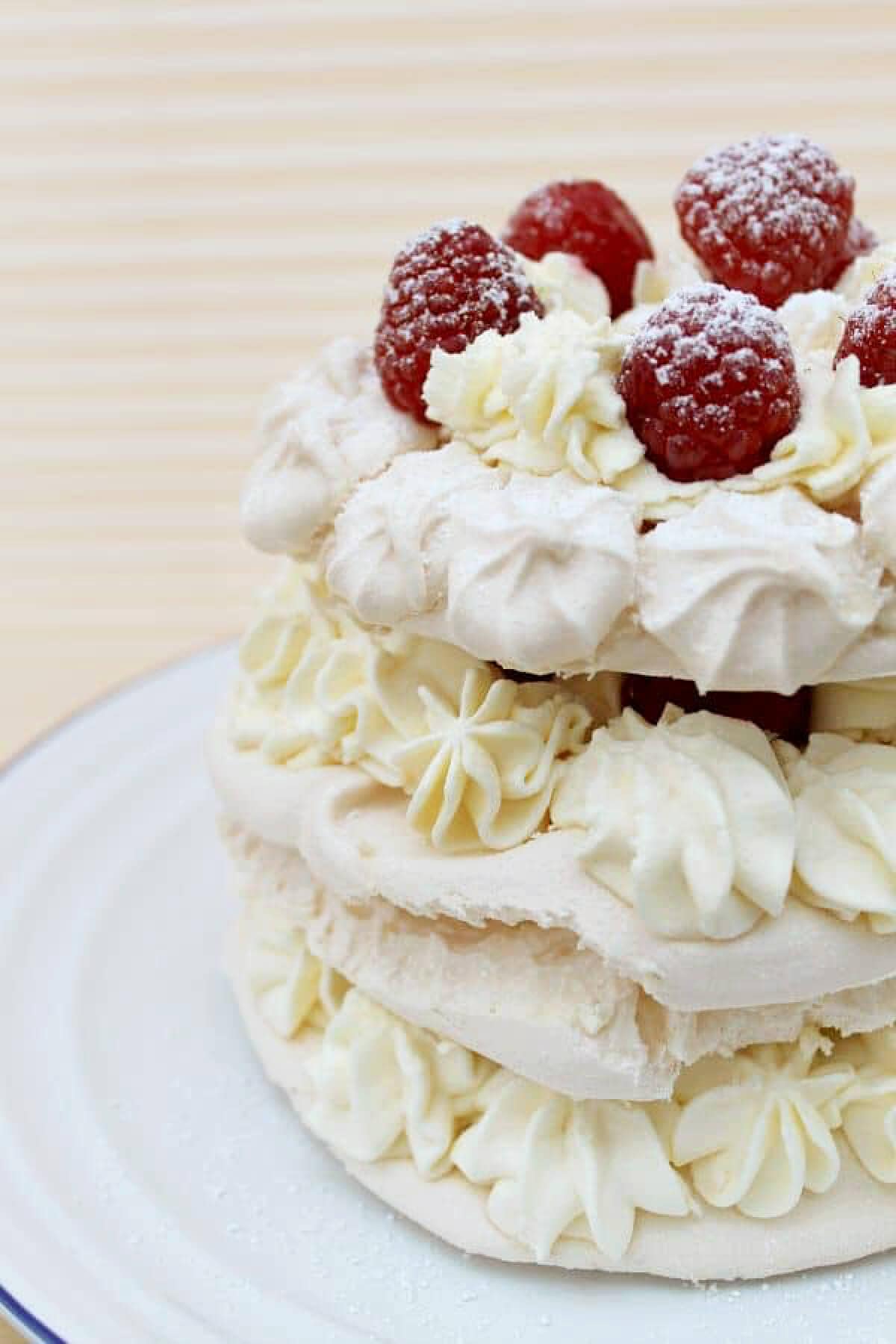 Close up of meringue layers with cream.