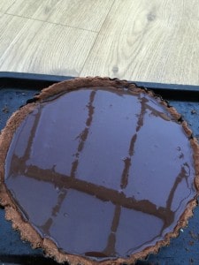 Mirror glaze poured onto the tart.
