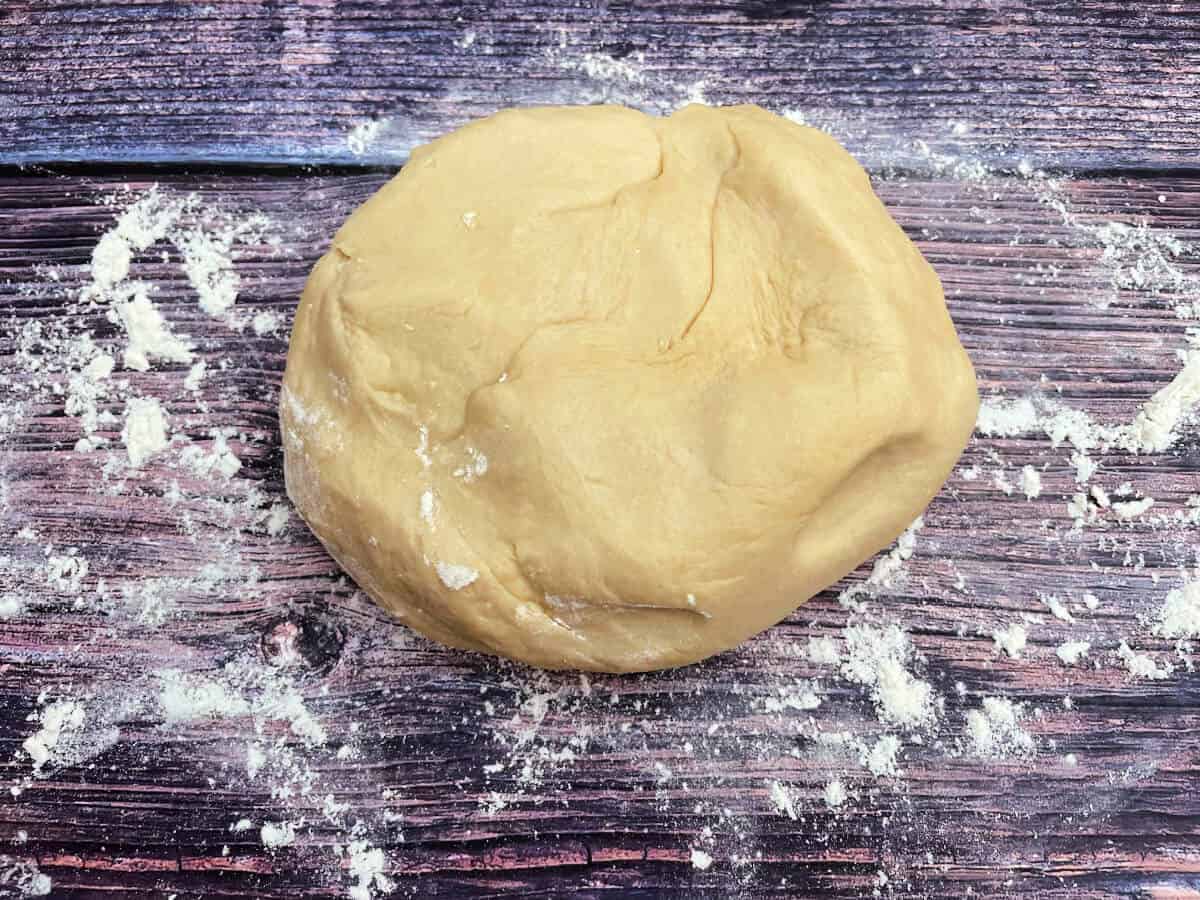 Kneaded dough, on floured surface.