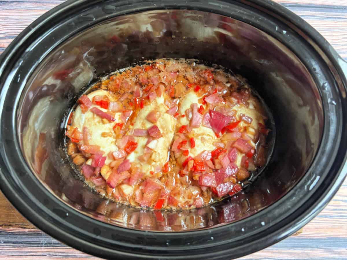 Cooked chilli lime chicken in slow cooker pot.