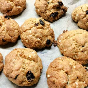 Close up of oat raisin cookies on a baking tray.