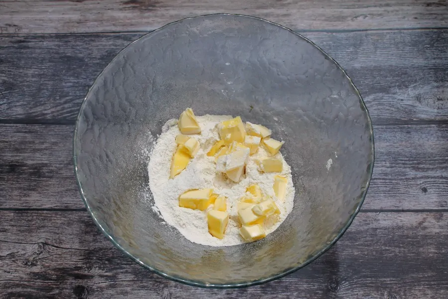 Flour with cubes of butter in a bowl