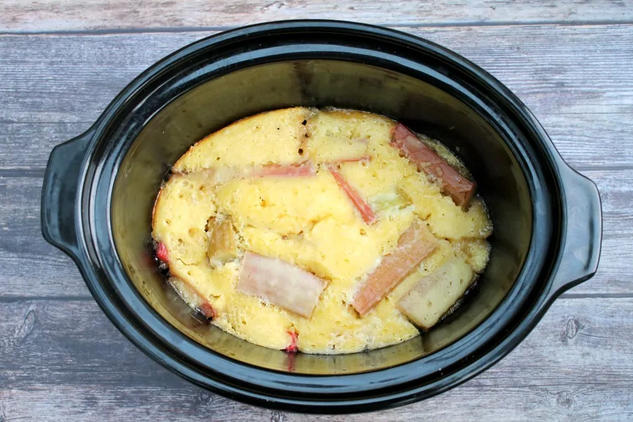 During cooking, rhubarb cobbler in slow cooker pot