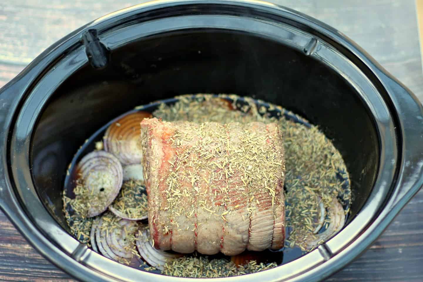 Brisket ready to cook in slow cooker.