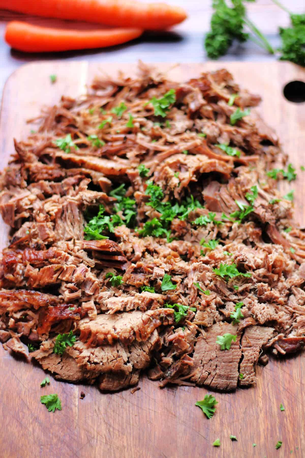Tender, flavorful shredded beef cooked in a slow cooker with herbs and spices. Perfect for sandwiches and meal prep.