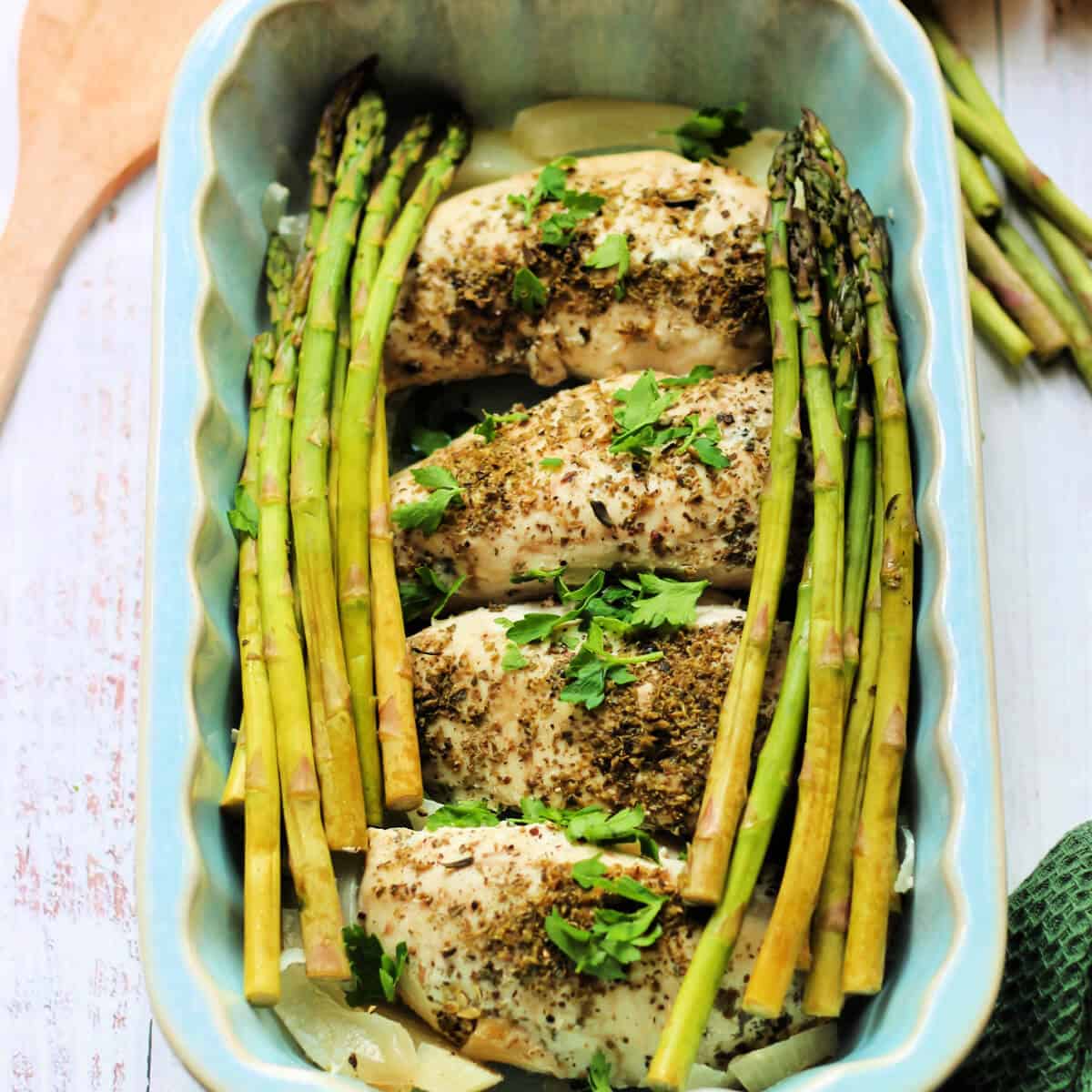 Chicken and asparagus in a serving dish.