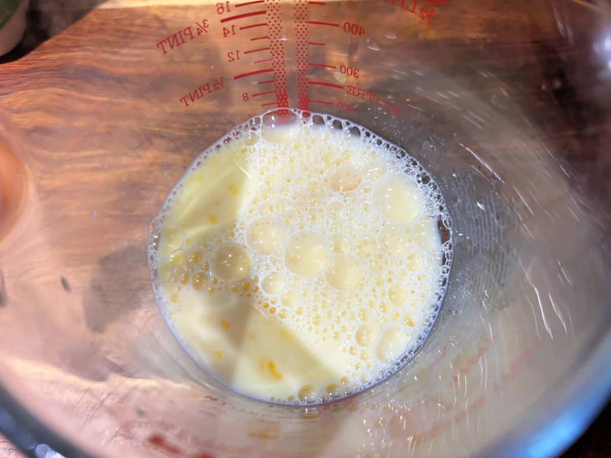Jug of milk with an egg beaten into it.