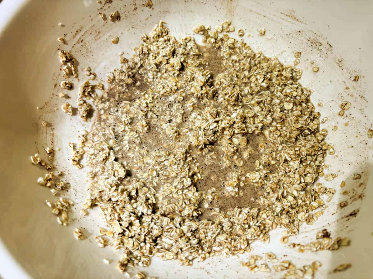 Baked oat mixture with milk added, in a bowl.