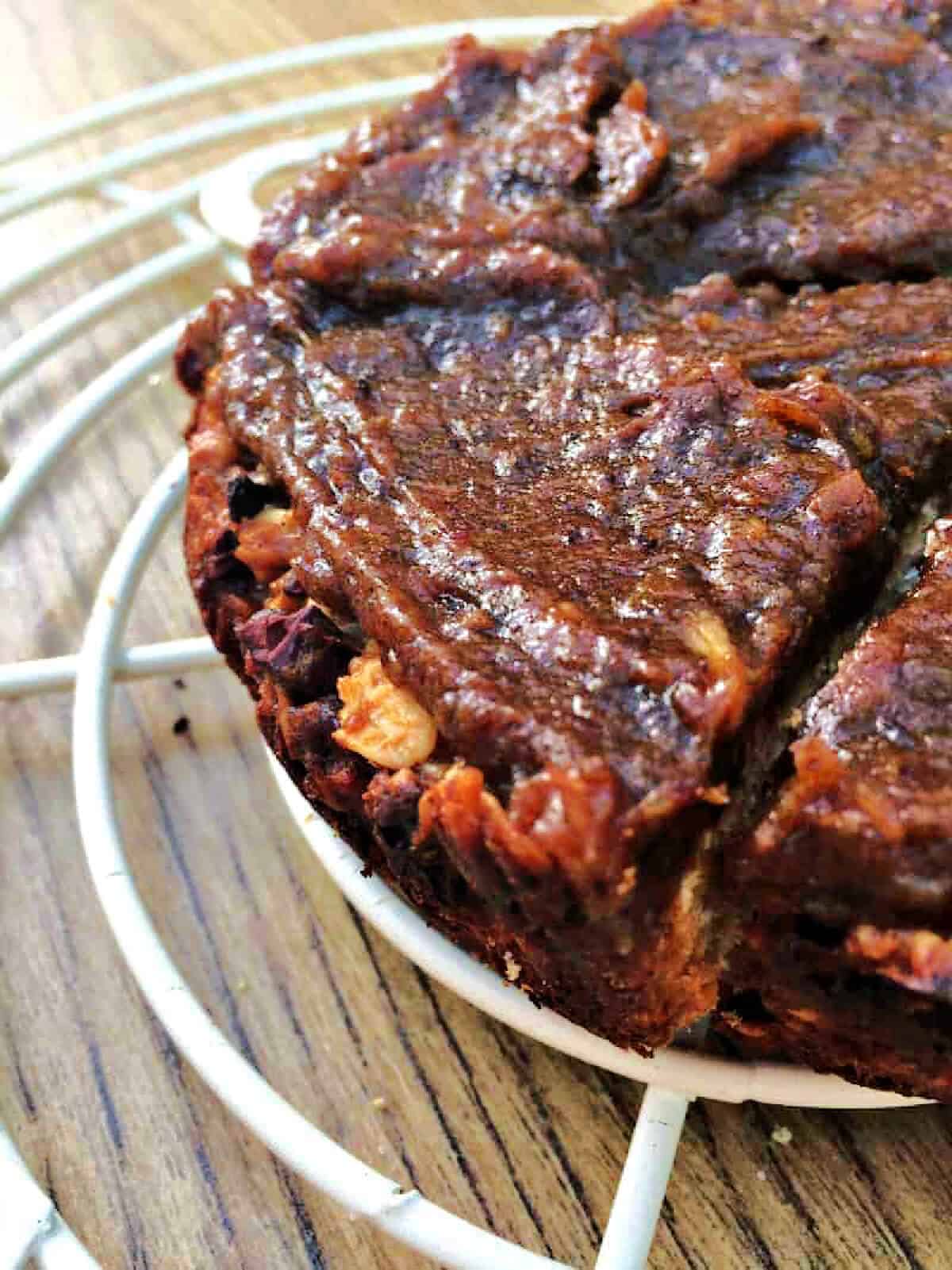 Edge of an oat bar slice with rich date caramel topping.