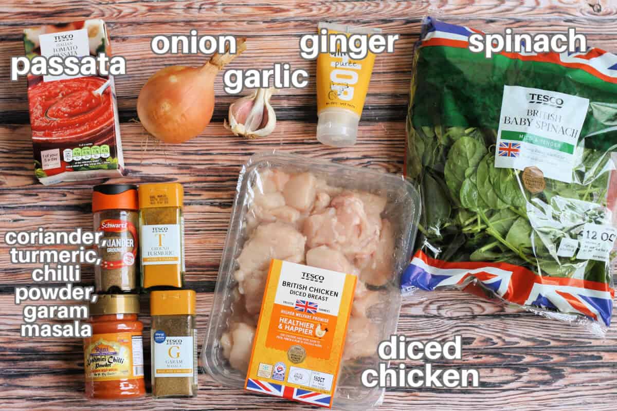 Labelled ingredients for chicken saag dish on a table.
