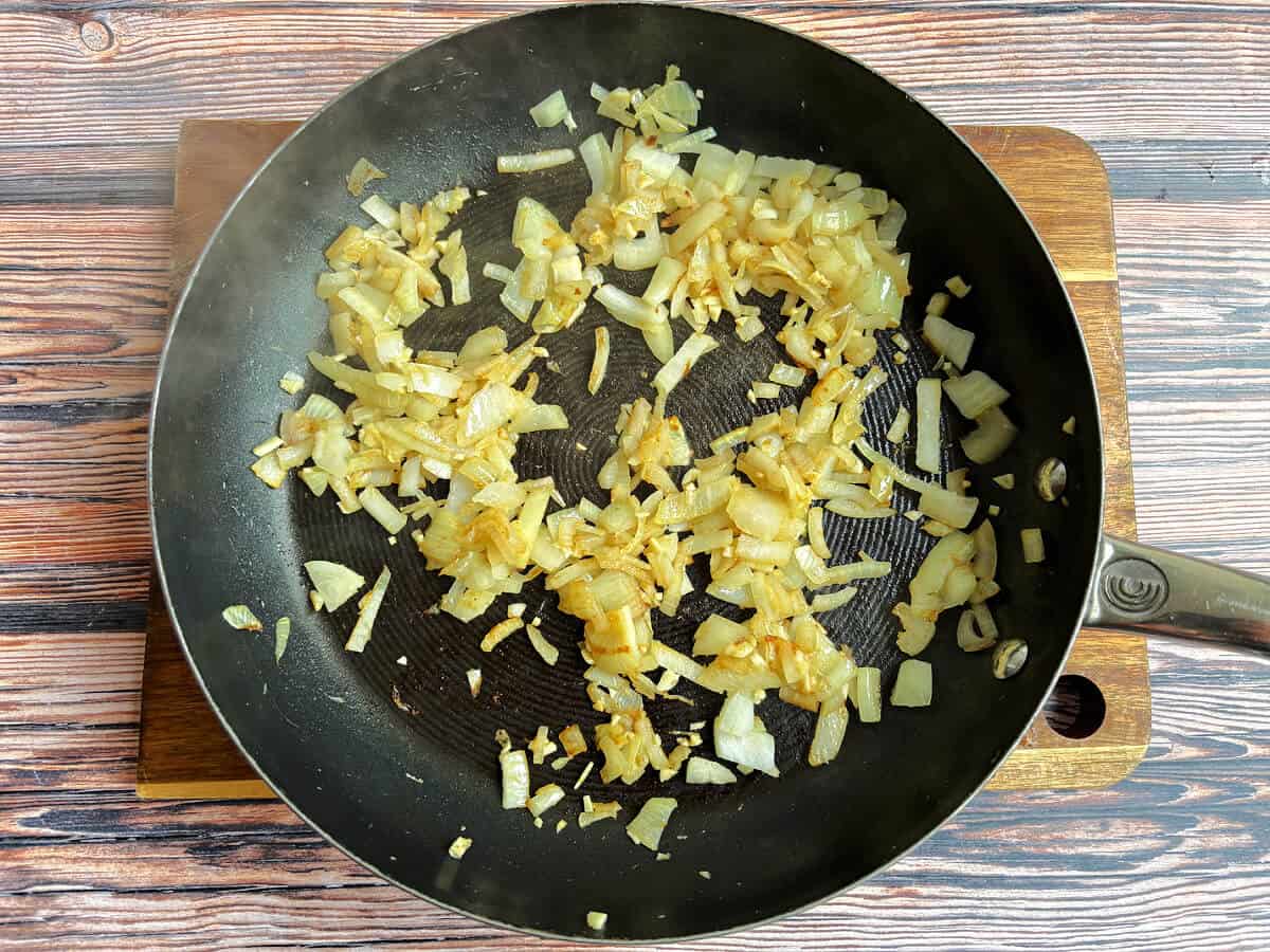 Fried onions in a frying pan.