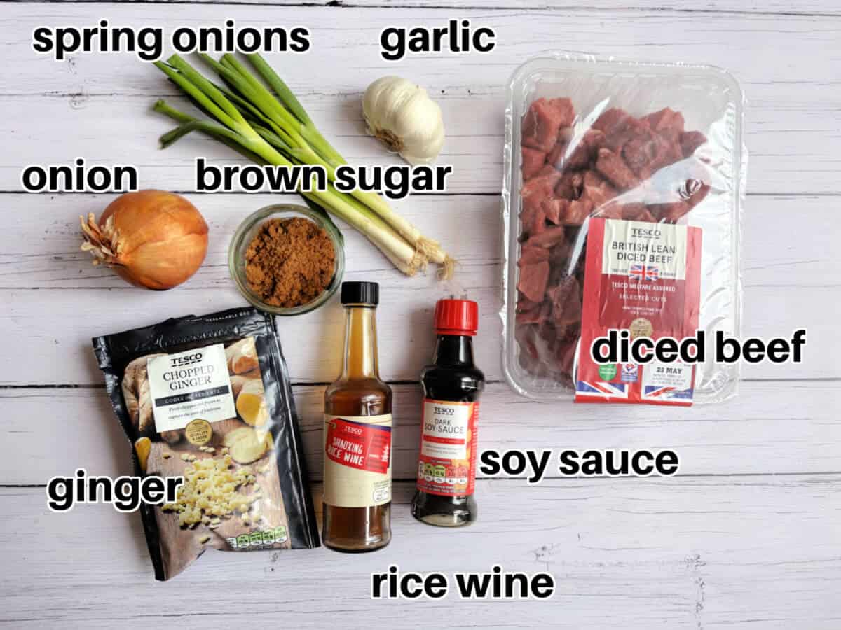 Labelled ingredients for teriyaki beef on white table.