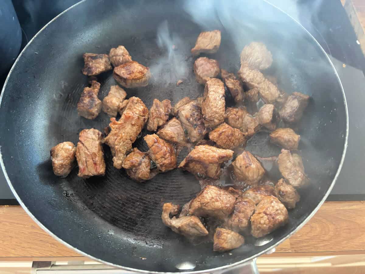 Browed diced beef in a saucepan.