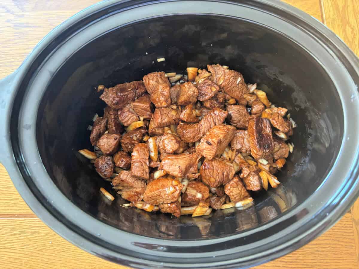 Beef teriyaki in slow cooker pot, ready to cook.