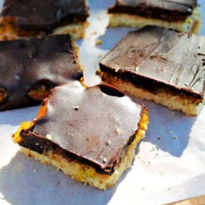 Slices of jaffa shortbread on white background.