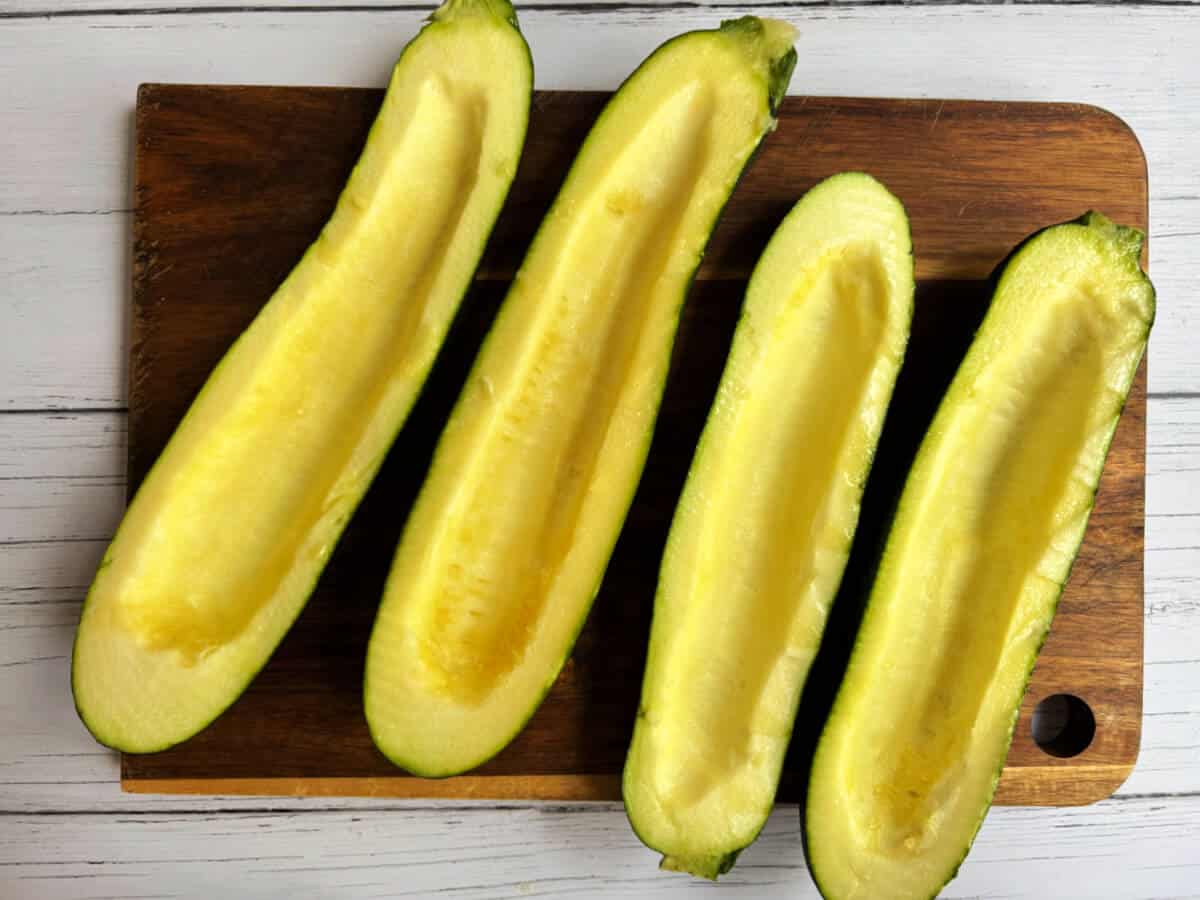 Courgettes with the centres scooped out.