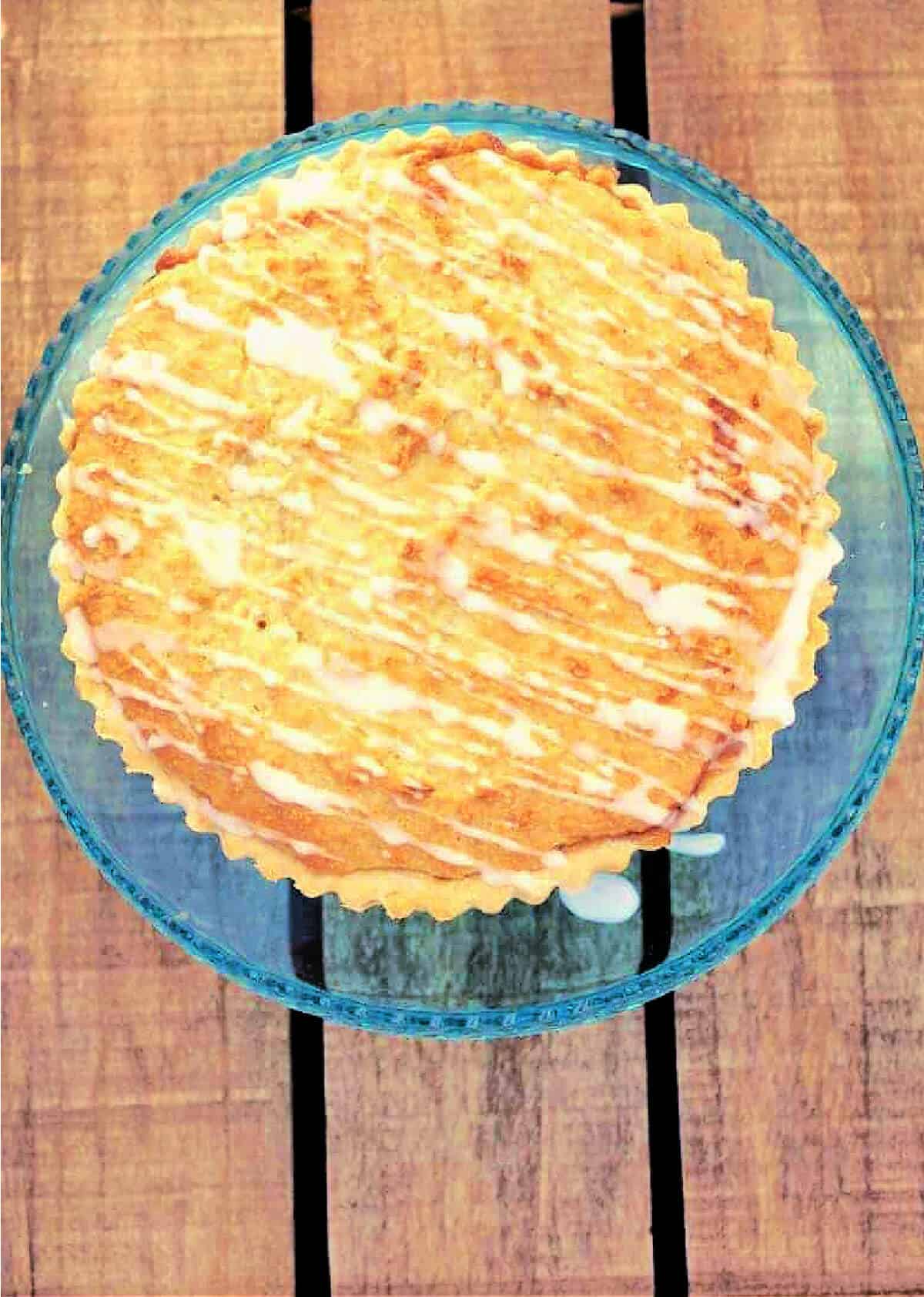 Overhead view of tart with drizzled white icing.